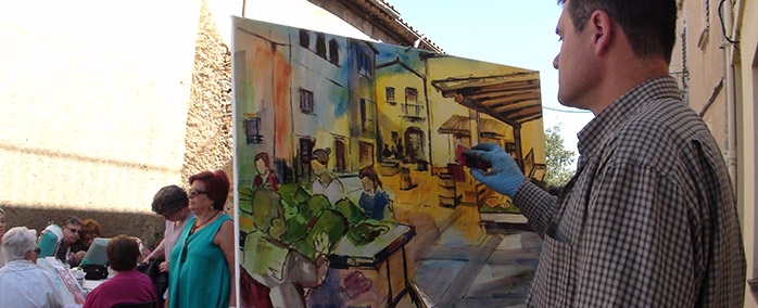 En Juan Tauleria, guanyador del concurs de pintura, pintant durant la fira.